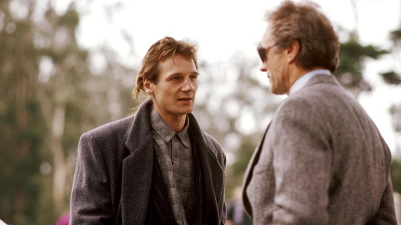 Liam Neeson talks with Clint Eastwood