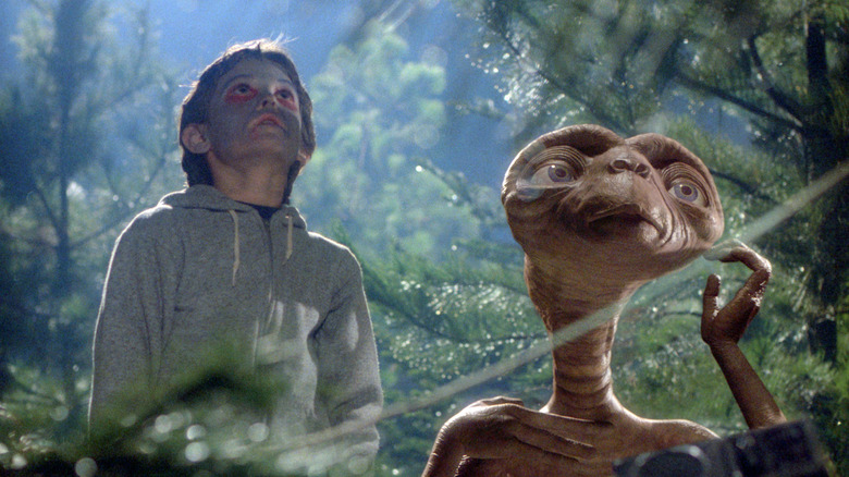 Elliott in the woods with E.T.