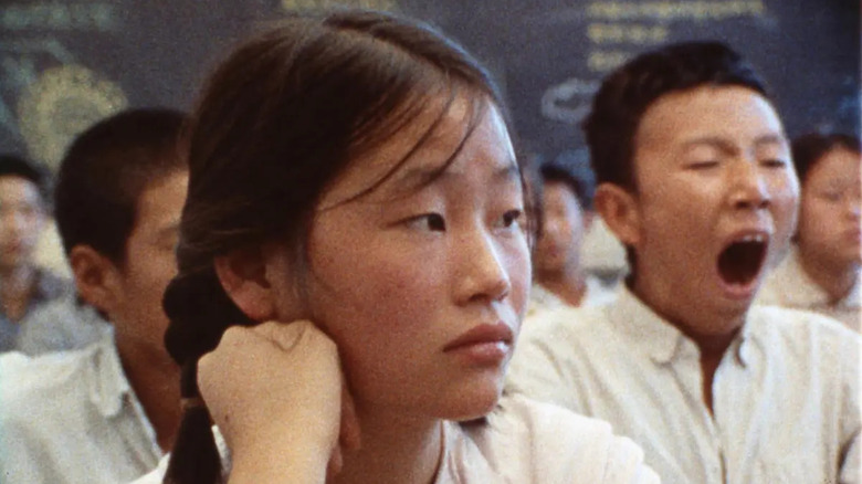 A female Chinese student attentively listens in class in "How Yukong Moved The Mountains"