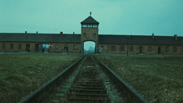 The entrance and railroad leading into the concentration camp Birkenau in "Shoah"