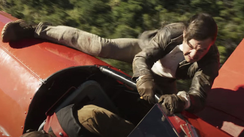 Ethan Hunt hangs onto the side of an airplane for dear life in Mission: Impossible -- The Final Reckoning