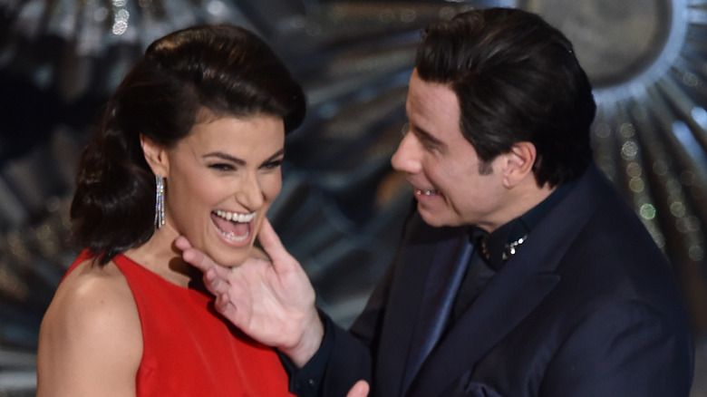 John Travolta touching Idina Menzel's chin at the Oscars