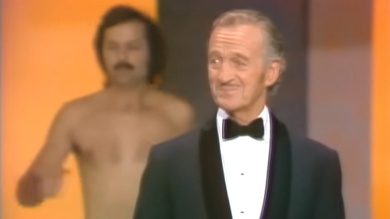 Streaker behind David Niven on Oscars stage