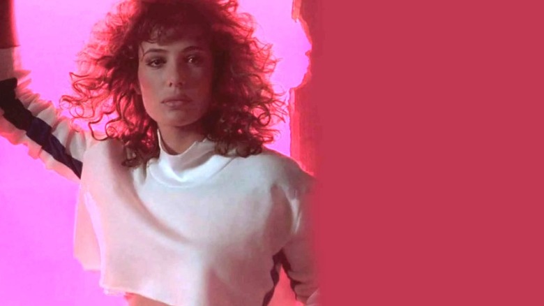 Lisa from "Weird Science" in front of neon light