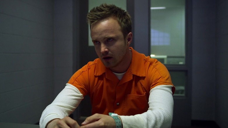 Aaron Paul as Tobey Marshall, crying in an interrogation cell in the 2014 Need for Speed film