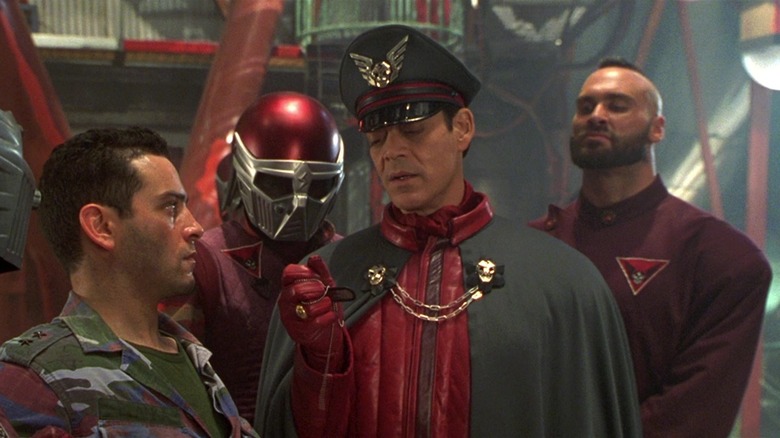 Raul Julia and Andrew Bryniarski as General M. Bison and Zangief interrogating a soldier in the 1994 Street Fighter film