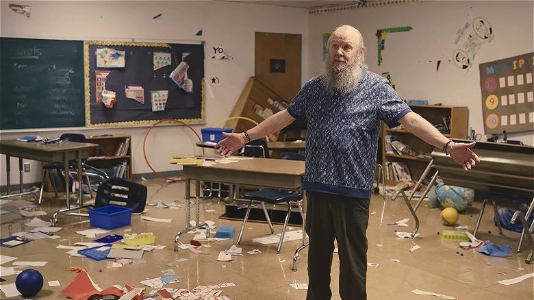 Shane in a messy classroom