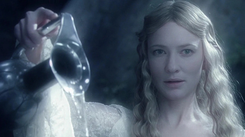 Cate Blanchett holds pitcher as Galadriel in The Lord of the Rings