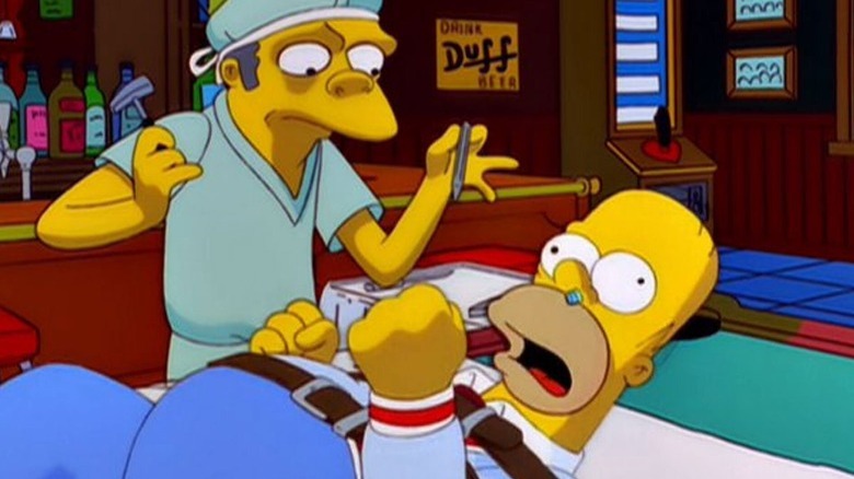 Moe performing surgery on Homer