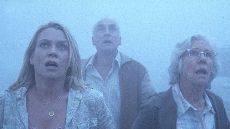 Survivors of the Mist look at some offscreen monstrosity