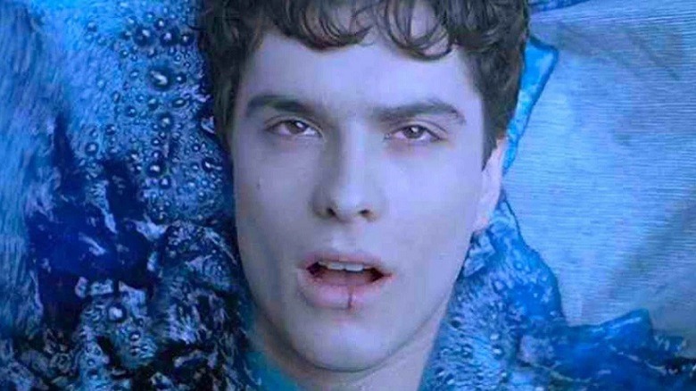 Rick Hearst lying in a pool of blue liquid