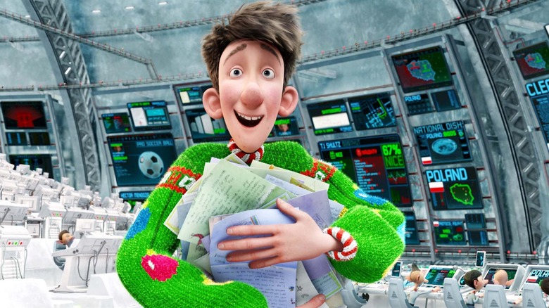 Arthur Clause wearing a bright green holiday sweater, clutching a bunch of letters to his chest in Arthur Christmas.