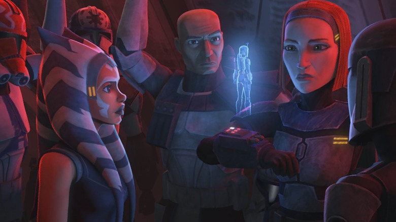 Ahsoka, Rex, Bo-Katan, and troops watch a holo