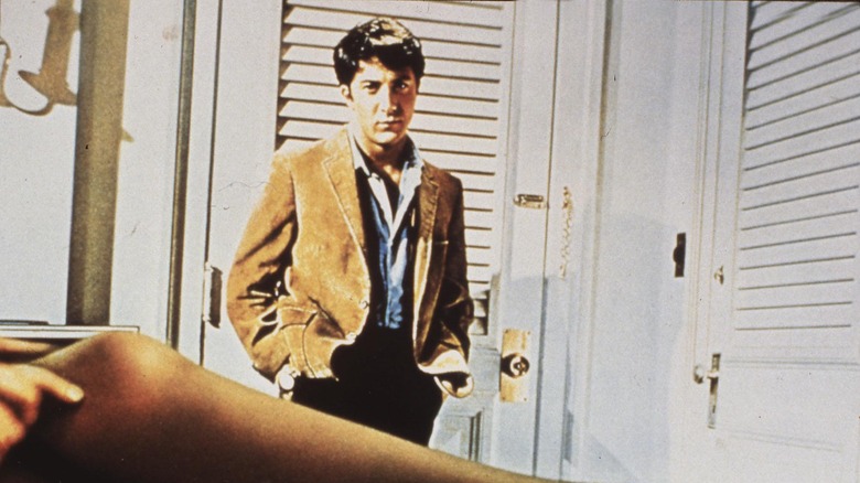 Dustin Hoffman staring at leg