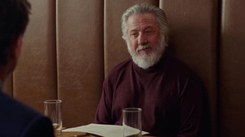 Dustin Hoffman seated at a table