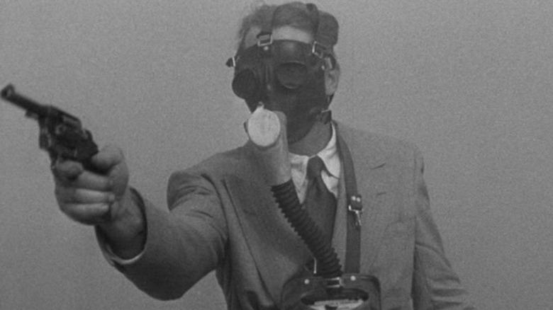 Dan Duryea Wears Gas Mask Criss Cross