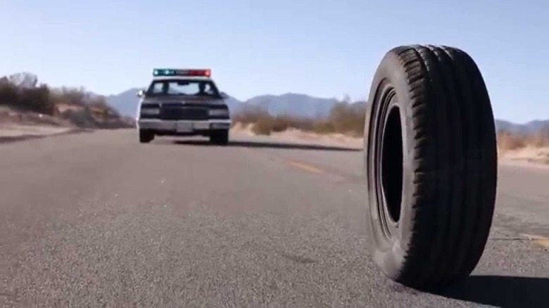 Police car approaches tire