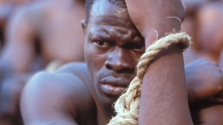 Djimon Hounsou with rope around his wrist
