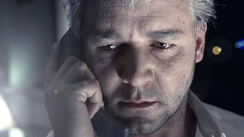 Russell Crowe listens on the phone.