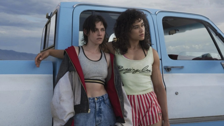 Kristen Stewart's Lou and Katy O'Brian's Jackie standing against a truck in Love Lies Bleeding