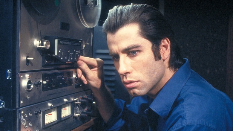 John Travolta listening