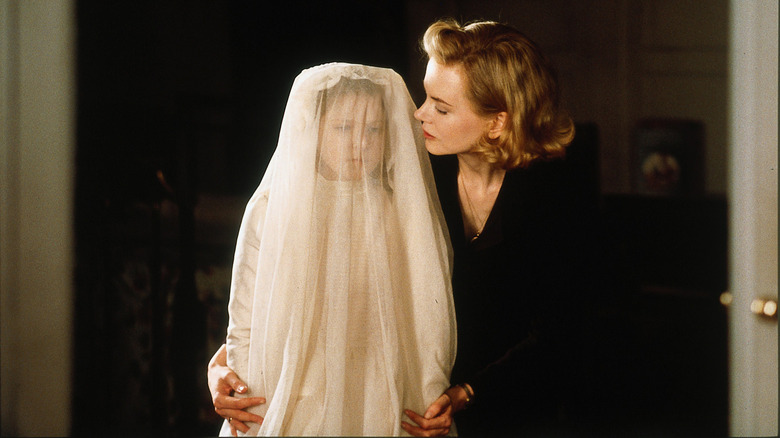 Nicole Kidman and ghostly clad child