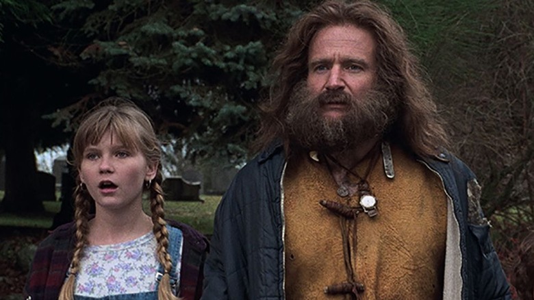 Robin Williams and Kristen Dunst in "Jumanji"