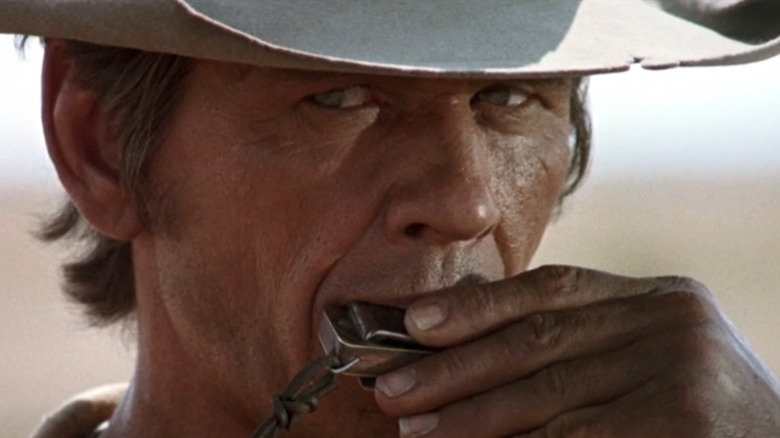 Charles Bronson plays harmonica