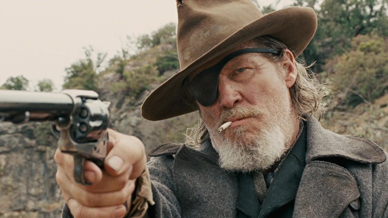 Jeff Bridges holds gun