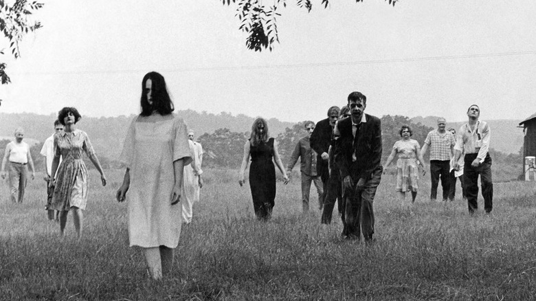 Zombies walk through field