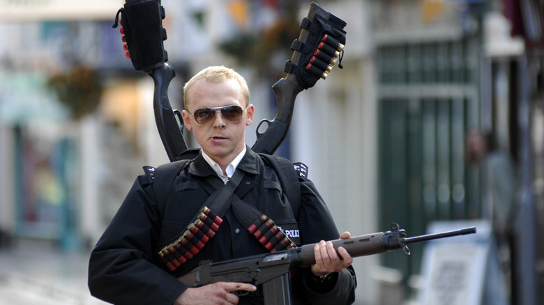 Simon Pegg with machine gun