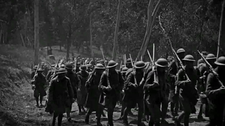 Soldiers marching through forest