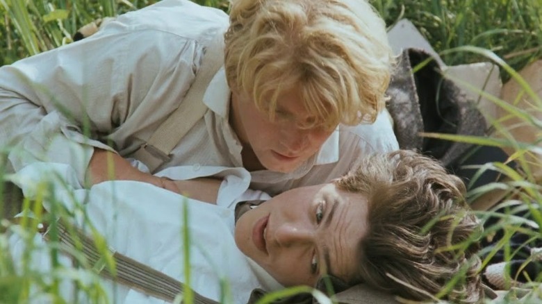 James Wilby and Hugh Grant in grass