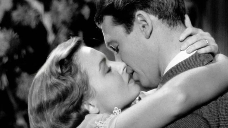 Donna Reed and Jimmy Stewart kiss in It's a Wonderful Life