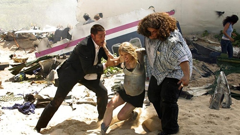 Jack and Hurley help Shannon on beach Lost