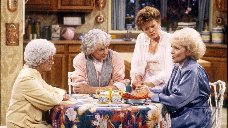 The Golden Girls sitting at a kitchen table