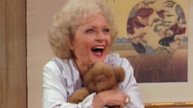 Betty White smiling with Teddy bear