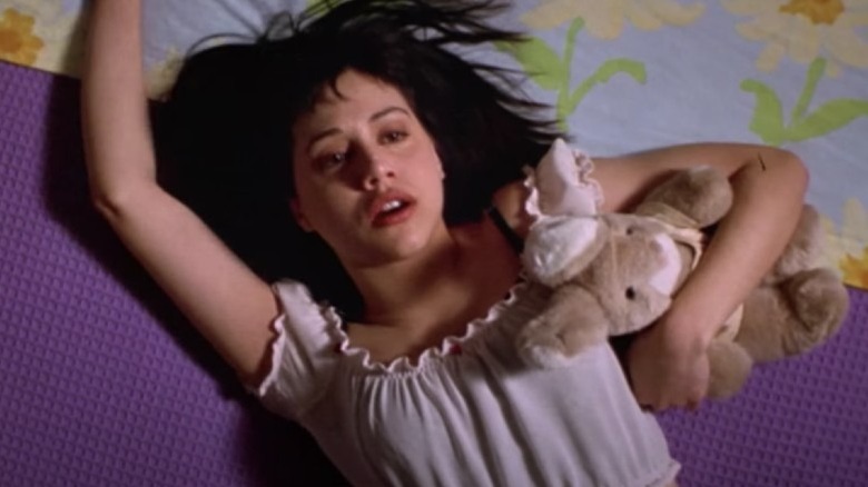 Brittany Murphy lying on bed