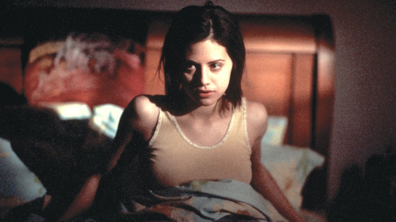 Brittany Murphy lying on bed