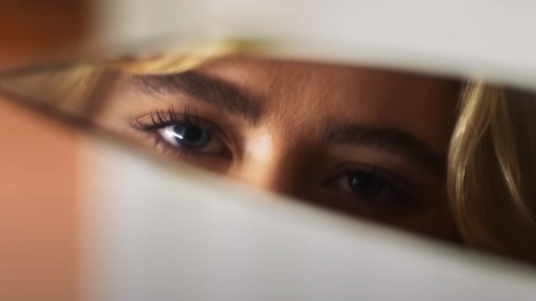 Eyes reflected in a knife