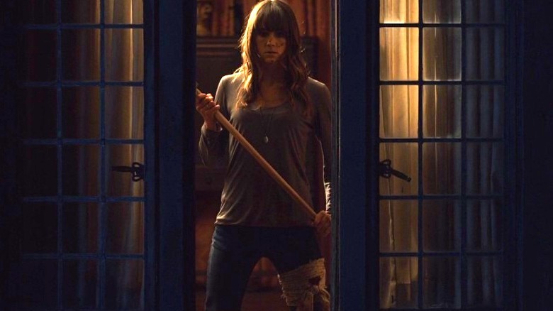 Sharni Vinson holding an axe