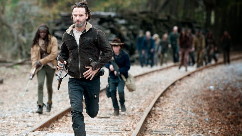 Walking Dead cast run traintracks