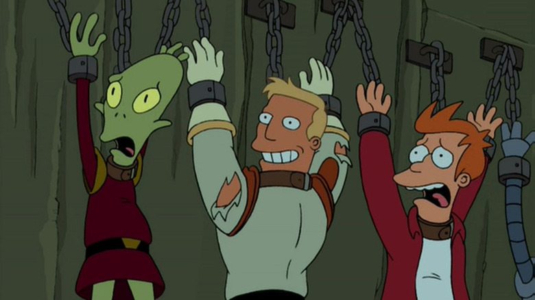 Kif, Zapp, and Fry held prisoner in Futurama's Amazon Women in the Mood