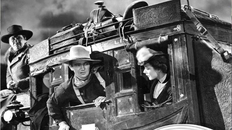 John Wayne riding a stagecoach