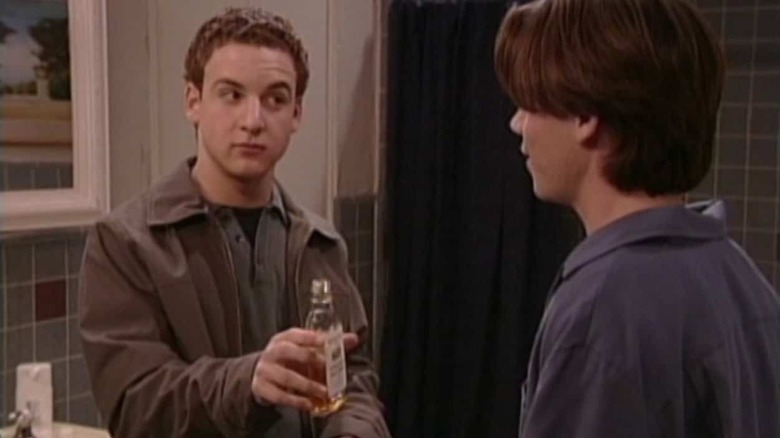 Ben Savage as Cory offering liquor to Rider Strong as Shawn on Boy Meets World