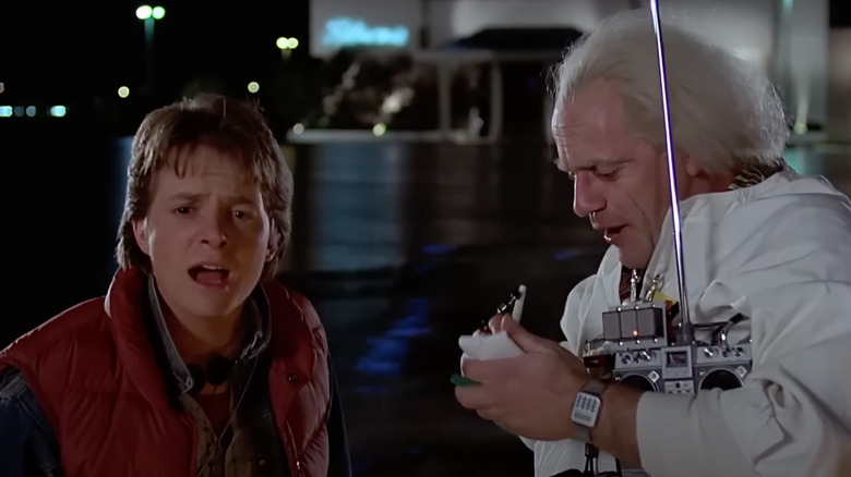 Michael J. Fox as Marty McFly looks exasperated next to Christopher Lloyd as Doc Brown in Back to the Future