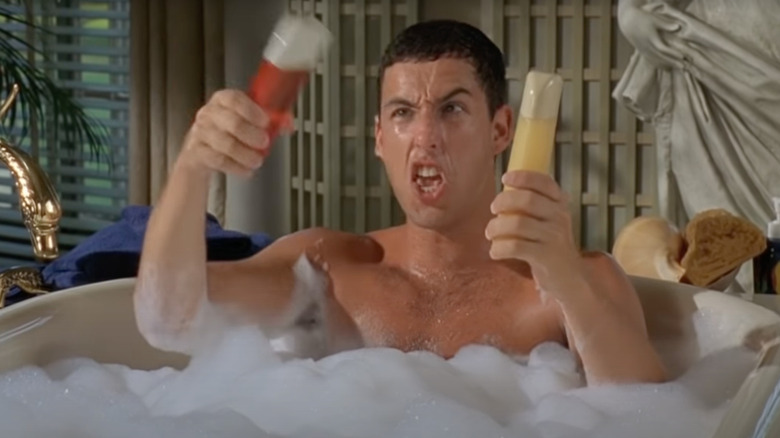 Adam Sandler as Billy Madison plays with shampoo in a bathtub.