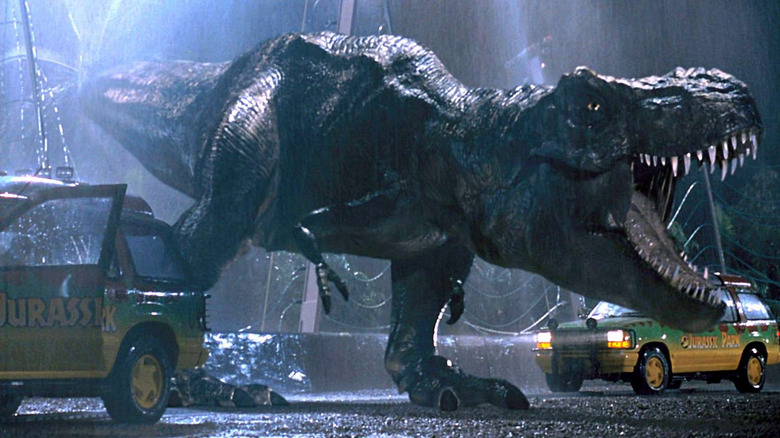 The T-Rex roars between two cars in Jurassic Park