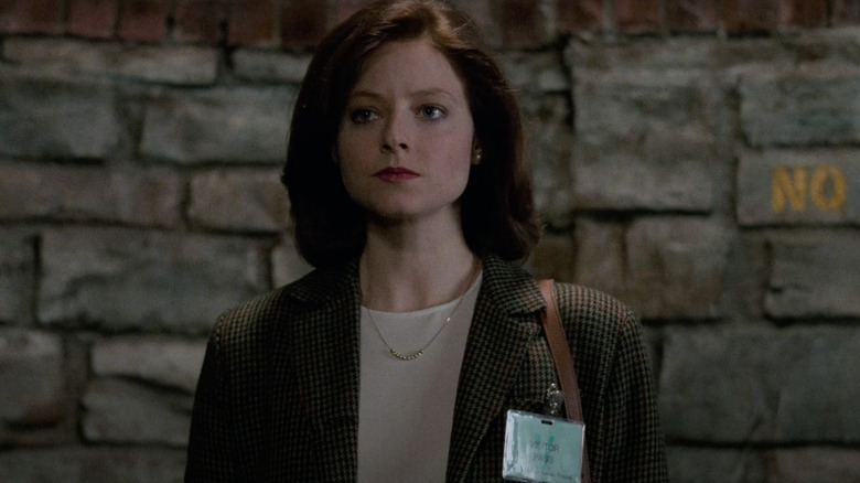 Jodie Foster as Clarice Starling walks through a maximum security prison in Silence of the Lambs