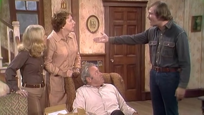 All in the Family's Michael ranting while Gloria, Edith, and a sitting Archie look on